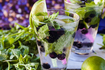 lemonade mojito with lime, blackcurrant and mint