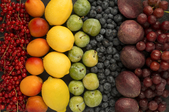Mixed fruits arranged in rainbow colours