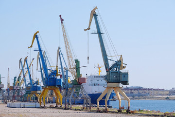 Fototapeta na wymiar the image of sea port tower cranes