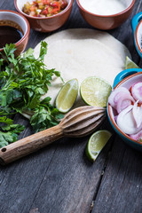 Making traditional mexican burritos with pulled beef
