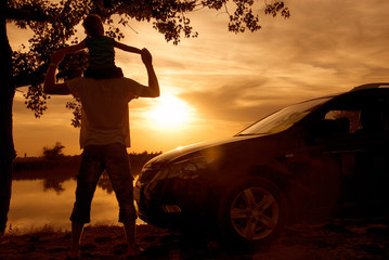 Family sunset on the lake