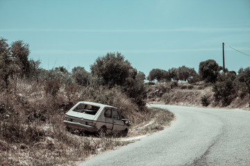Fototapeta premium Abandoned car and road