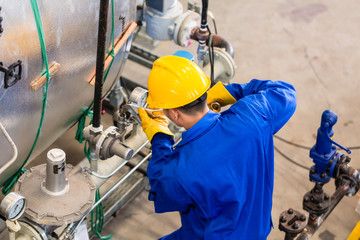 Industrial worker working at machine