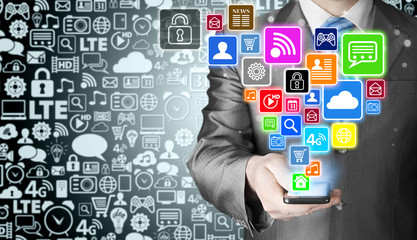 Business man using smart phone with social media icon set