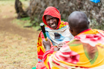 Massai men shaking hand concluding an agreement