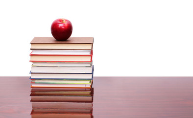 apple with books on wood table