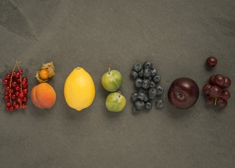 Mixed rainbow fruit on slate