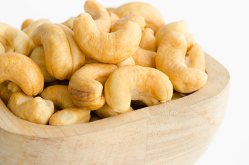 cashew in wooden cup.