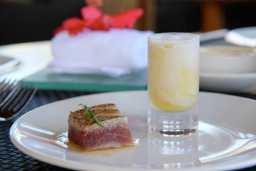 Tuna Steak and refreshing drink starter at  Likuliku Island Resort in Fiji