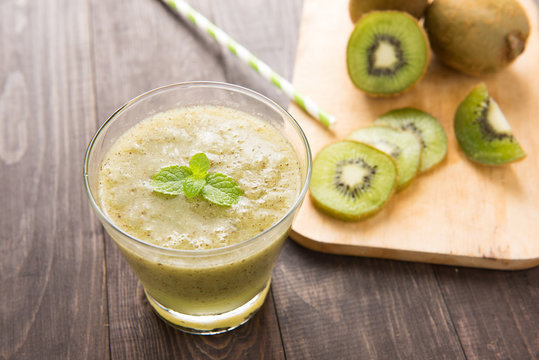 kiwi smoothie with fresh fruits on wooden table