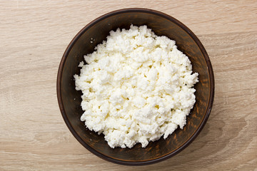 Culinary cheese in a clay bowl