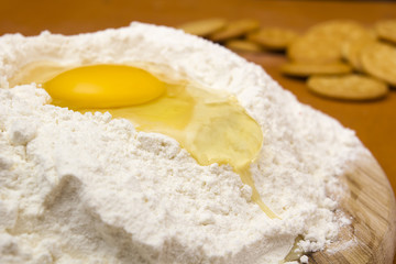 Obraz na płótnie Canvas Chicken egg in the flour
