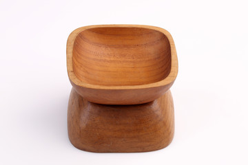 Wooden bowl made by Teak isolated on white background