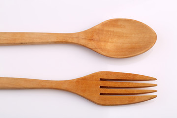 Wooden fork and wooden spoon made by Teak isolated on white back
