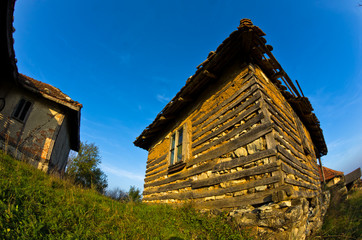 Old house near Danube river at sunset of autumn sunny day