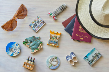 various passports and souvenir magnets from several world country