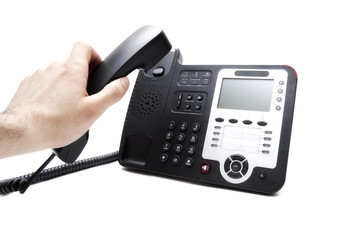 hand with the handset and the phone