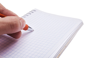 Hand writing a message in the open notebook