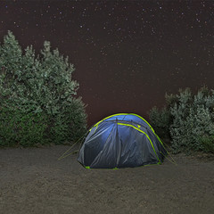 Camping tent under night starry sky. Camping adventure.