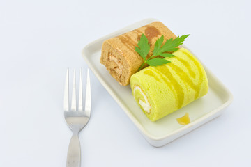 Roll cake In the plates and fork