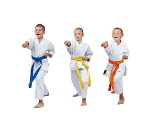 Children in karategi are beating kick gyaku-tsuki