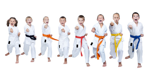 In karategi eight athletes are beating punch gyaku-tsuki