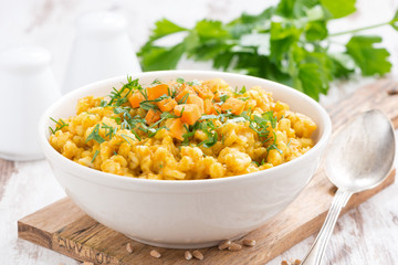 barley porridge with pumpkin and greens, horizontal