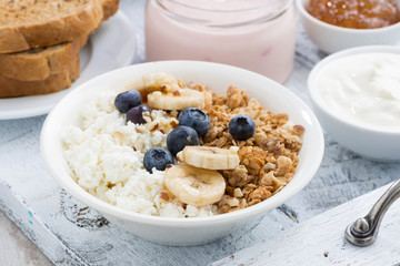 cottage cheese, muesli and fresh fruit for breakfast, closeup