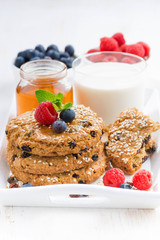 oatmeal cookies, milk and berries for a healthy breakfast