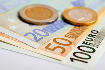 Closeup of euro banknotes and coins