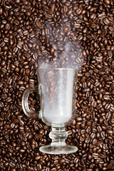 Irish coffee glass with smoke in coffee beans