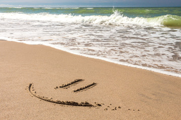 DRAWING ON THE SANDY BEACH