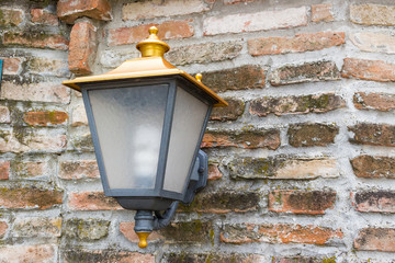 lamp on medieval brickwall