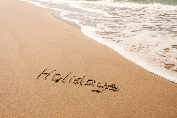 DRAWING ON THE SANDY BEACH