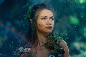 Elf woman in a magical forest