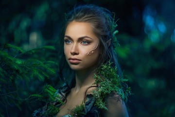 Elf woman in a magical forest