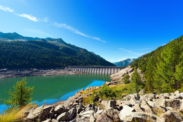 Bissina Lake with Dam - Adamello Trento Italy. Bissina Dam (1952-1962). Straight concrete dam (563 m of length) in the National Park of Adamello Brenta. Trentino Alto Adige, Italy