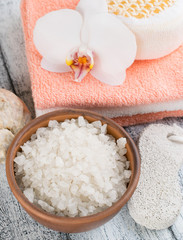 Spa salon with sea salt, towels and flowers