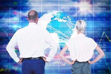 Composite image of  smiling business people with hands on the hips