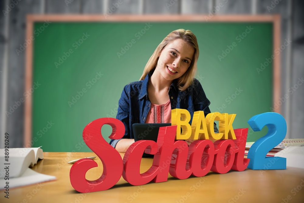 Canvas Prints Composite image of student studying in the library with tablet