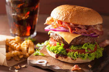 bacon cheese burger with beef patty tomato onion cola