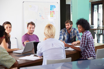 Manager Leading Creative Brainstorming Meeting In Office