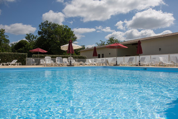 Private swimming pool at summertime in resort hotel