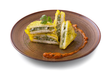 indian snack paneer pasanda served with curry sauces
