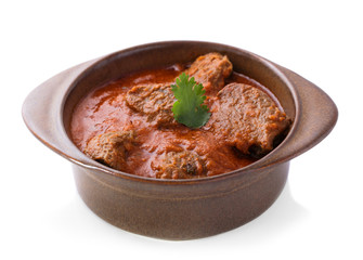 indian lamb rogan josh served in pottery