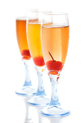 three glass of flavoured cocktail with cherry inside