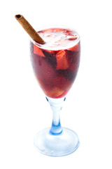 a glass of red sangria with cinnamon