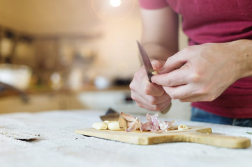 Man peeling garlic