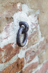 Old iron ring in a brick wall