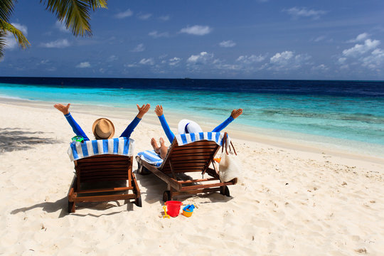 happy couple relax on a tropical beach
